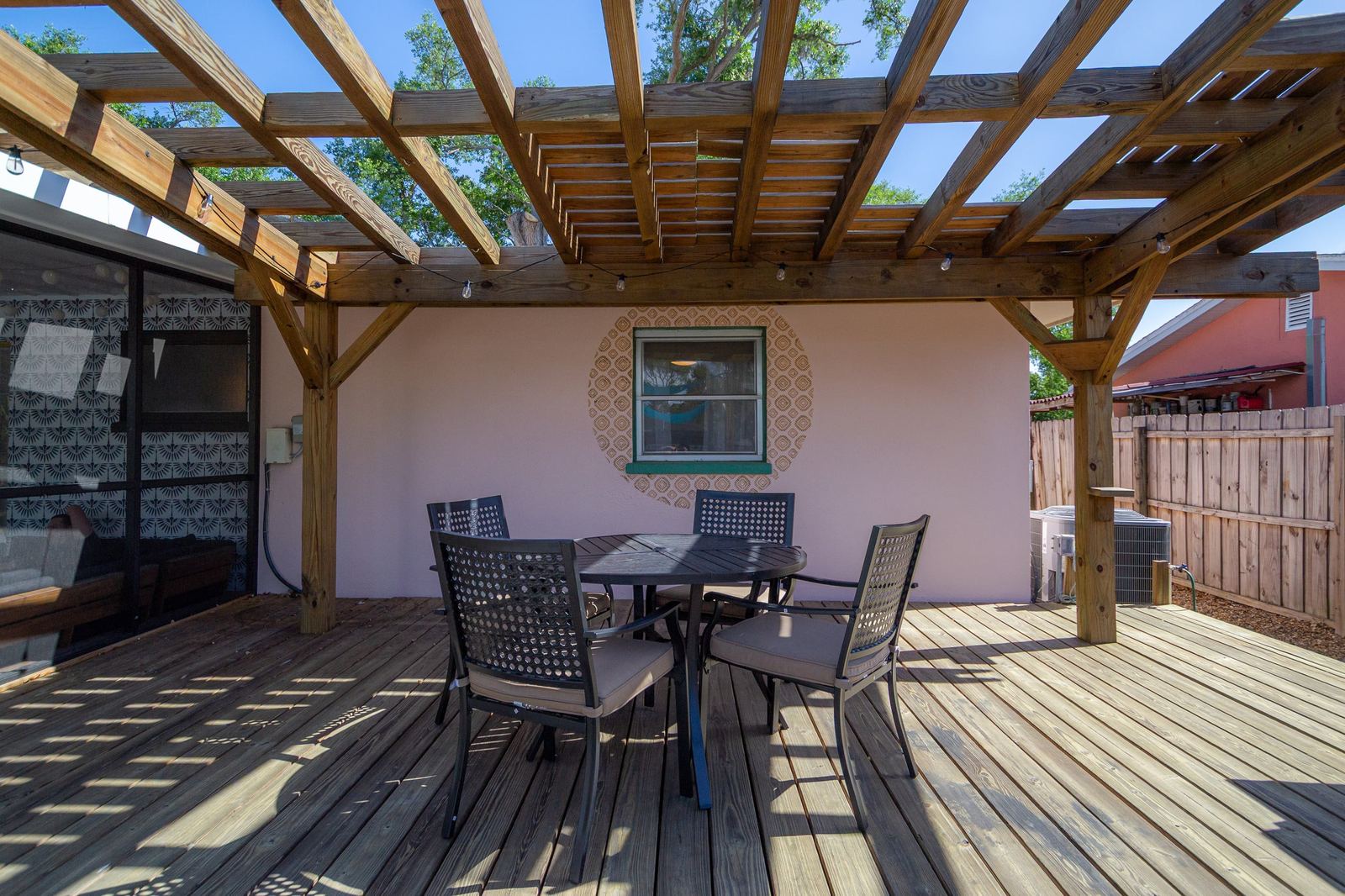 Outdoor dining table under the pergola