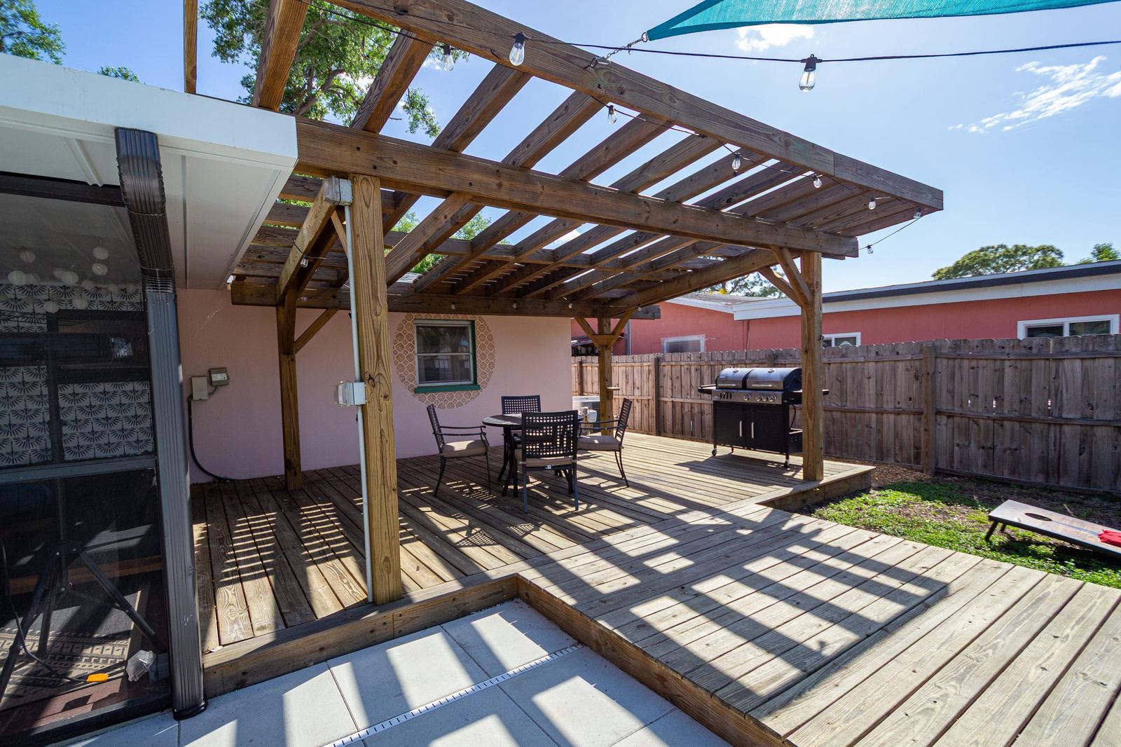 Pergola deck with gas and charcoal grill